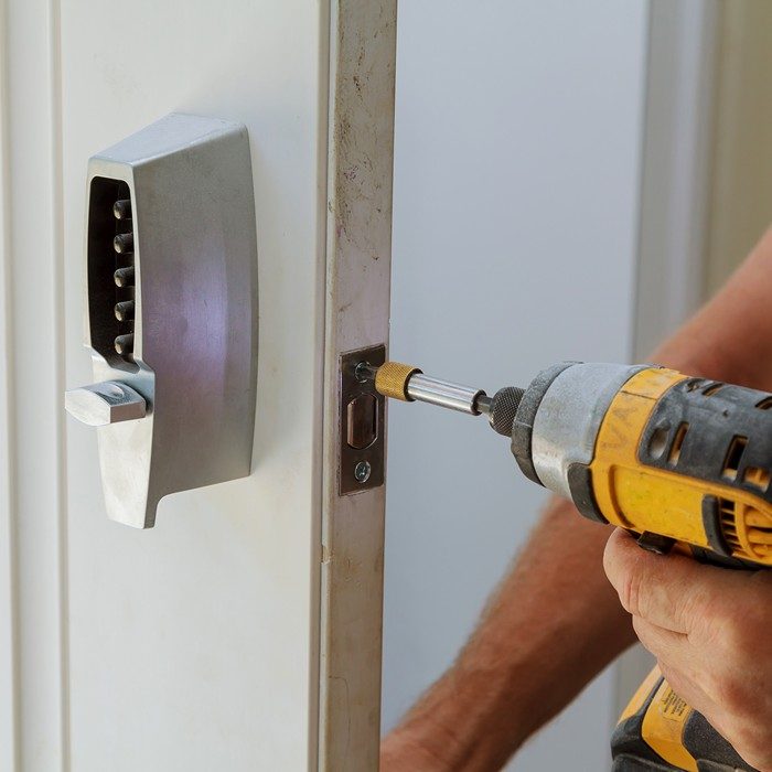 Residential locksmith repairing a home loc Residential locksmith repairing a home loc