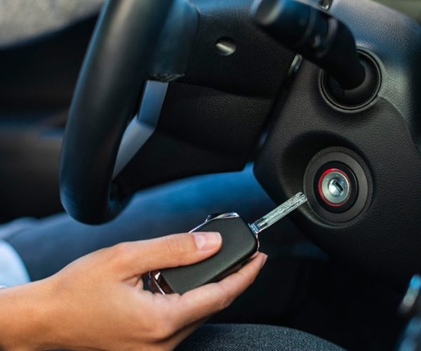 side-view-businesswoman-using-keys-turn-car